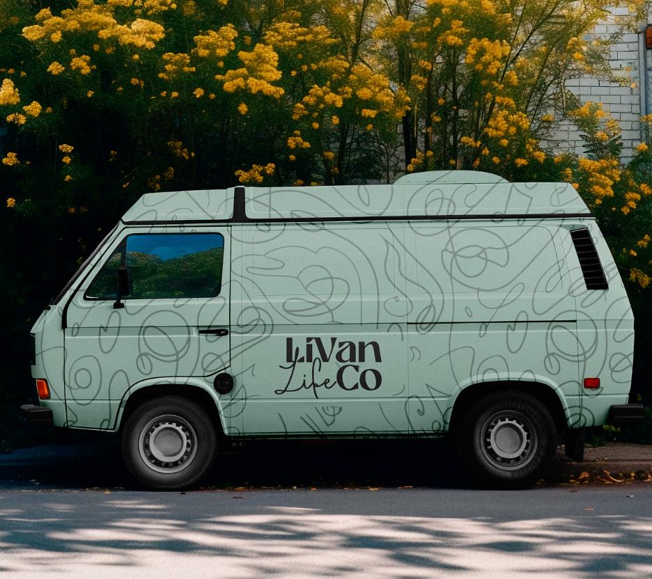 Van with 'LiVan Life Co' branding parked outdoors with trees and flowers in the background