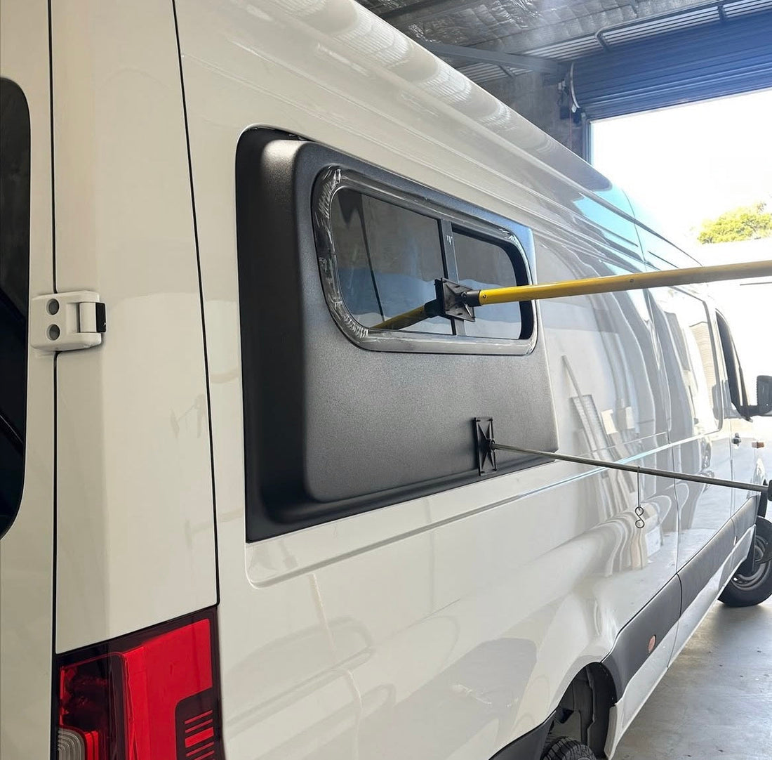 White Mercedes Sprinter with a Fibreglass Flare installed on the side of the van towards the rear