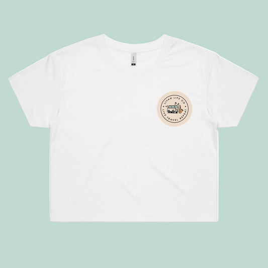 White t-shirt with a logo on the back against a light green background