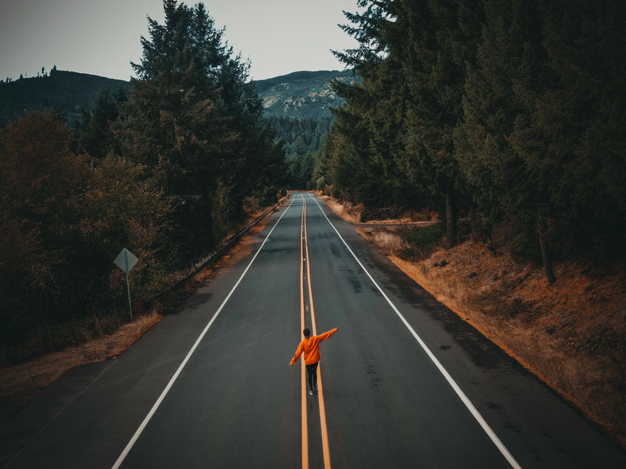 Person walking down a deserted road